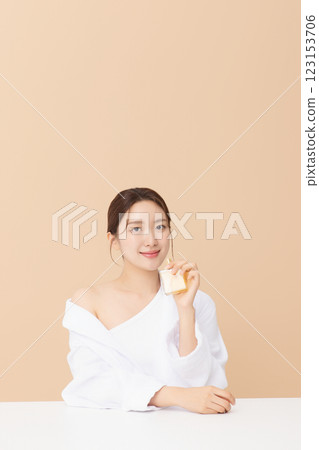 Portrait of beautiful young woman posing with oil Portrait of beautiful young woman posing with oil 123153706