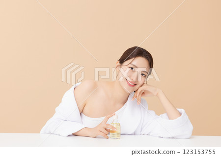 Portrait of beautiful young woman posing with oil 123153755