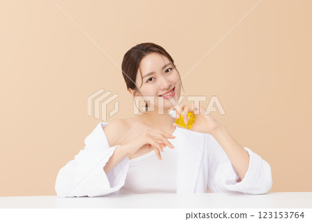 Portrait of beautiful young woman posing with oil Portrait of beautiful young woman posing with oil 123153764