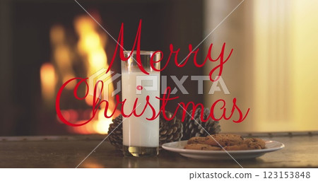 Image of merry christmas text over hands with cookies and milk Image of merry christmas text over hands with cookies and milk 123153848