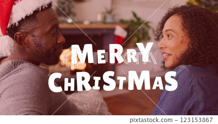 Image of merry christmas text over african american couple talking Image of merry christmas text over african american couple talking 123153867