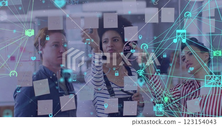 Image of media and communication networks over diverse casual colleagues brainstorming at office 123154043