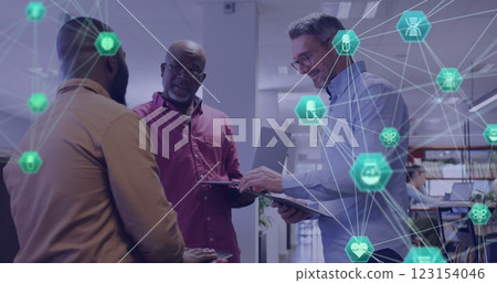 Image of medical and communication networks over diverse male colleagues talking at office Image of medical and communication networks over diverse male colleagues talking at office 123154046