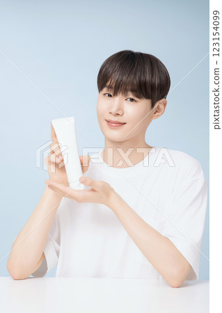 A young man demonstrating basic men's cosmetics 123154099