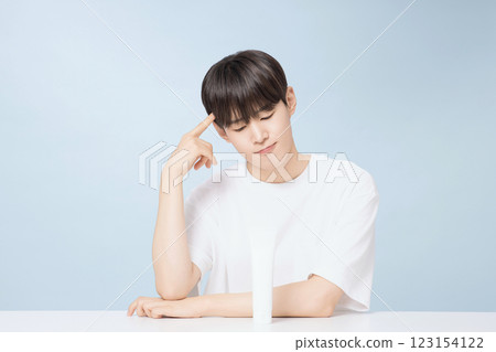 A young man demonstrating basic men's cosmetics 123154122