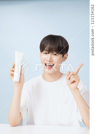 A young man demonstrating basic men's cosmetics 123154162