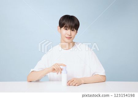 A young man demonstrating basic men's cosmetics 123154198