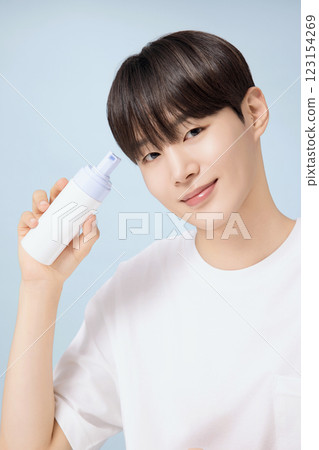 A young man demonstrating basic men's cosmetics 123154269