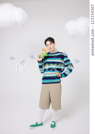 Cropped view of man standing in clouds holding toy bubble gun 123154567