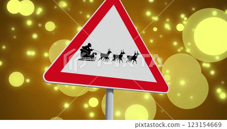 Image of santa in sleigh on road sign over yellow spots 123154669