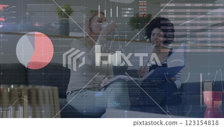 Image of data processing and diagrams over diverse female colleagues talking in office Image of data processing and diagrams over diverse female colleagues talking in office 123154818