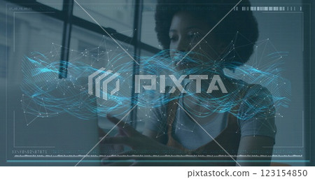 Image of financial data processing over african american businesswoman using laptop Image of financial data processing over african american businesswoman using laptop 123154850