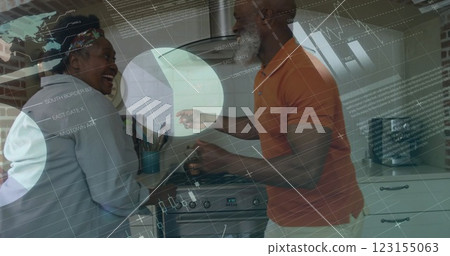 Image of financial data processing over senior african american couple dancing in kitchen Image of financial data processing over senior african american couple dancing in kitchen 123155063