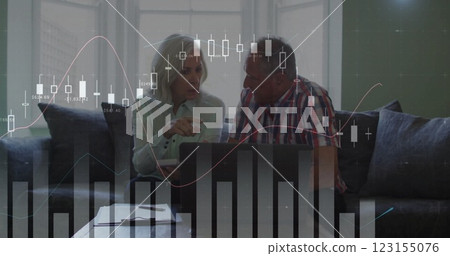 Image of financial data processing over senior caucasian couple using laptop Image of financial data processing over senior caucasian couple using laptop 123155076