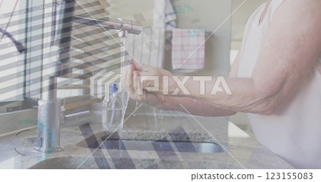 Image of financial data processing over senior caucasian woman washing hands 123155083