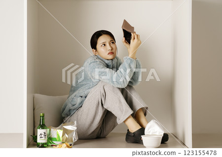 A student drinking soju from a box 123155478