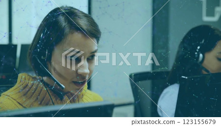Image of network of icons over diverse business people with phone headsets Image of network of icons over diverse business people with phone headsets 123155679