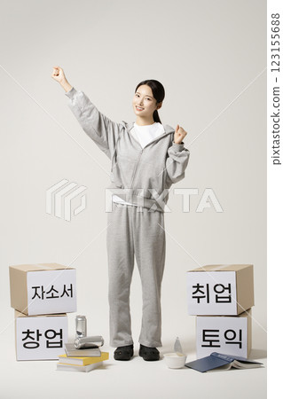 A job seeker in his 20s carrying heavy boxes including personal statements, employment, starting a business, and TOEIC. 123155688