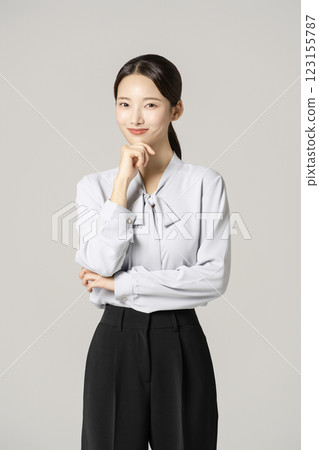 A woman in her 20s wearing a suit who successfully found a job 123155787