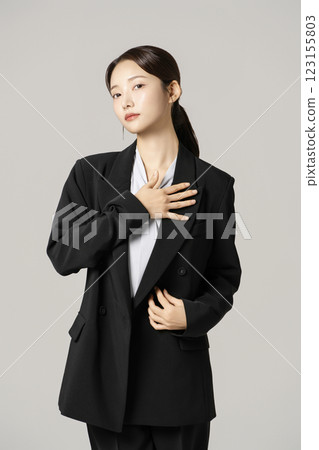 A woman in her 20s wearing a suit who successfully found a job 123155803