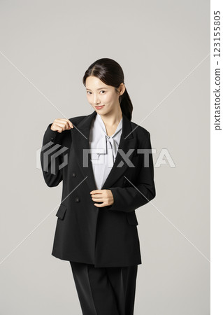 A woman in her 20s wearing a suit who successfully found a job 123155805
