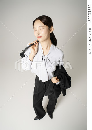 A woman in her 20s wearing a suit who successfully found a job A woman in her 20s wearing a suit who successfully found a job 123155823
