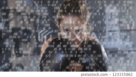 Image of binary coding over caucasian woman wearing boxing gloves at gym 123155862