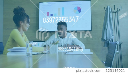 Business data processing image over colleagues discussing documents in office 123156021