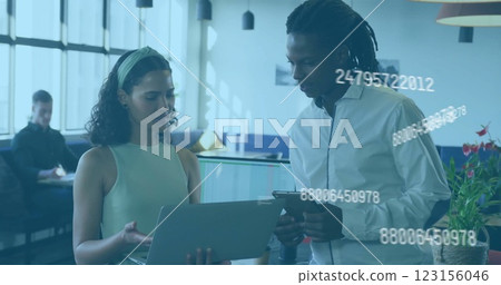 Business data processing image over diverse colleagues discussing work in office 123156046