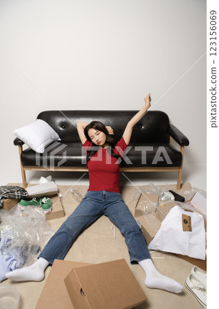 A young man in his 20s suffering from burnout, helpless in a messy room A young man in his 20s suffering from burnout, helpless in a messy room 123156069