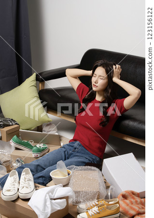 A young man in his 20s suffering from burnout, helpless in a messy room A young man in his 20s suffering from burnout, helpless in a messy room 123156122