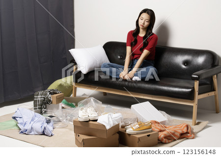 A young man in his 20s suffering from burnout, helpless in a messy room A young man in his 20s suffering from burnout, helpless in a messy room 123156148