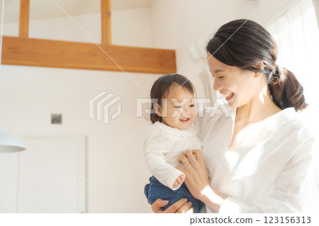 A mother holding a baby 123156313
