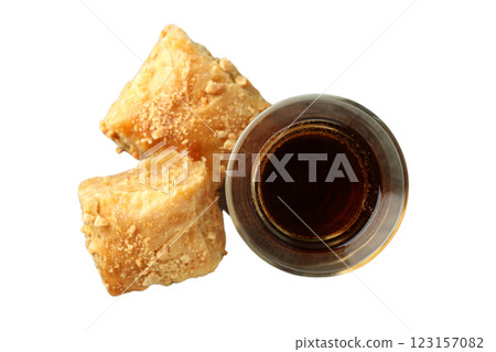 PNG, Ramadan. Baklava in a plate with a glass of tea,isolated on a white background. 123157082