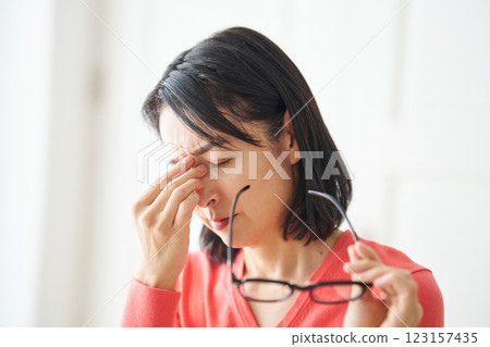 Woman feeling tired eyes Woman feeling tired eyes 123157435