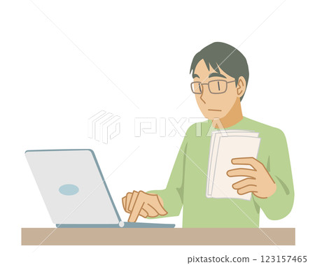 A man entering data into a laptop 123157465