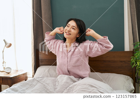 A woman waking up refreshed in the morning A woman waking up refreshed in the morning 123157865