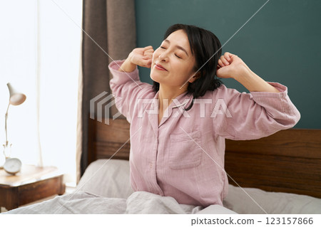 A woman waking up refreshed in the morning A woman waking up refreshed in the morning 123157866