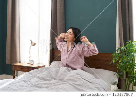 A woman waking up refreshed in the morning 123157867