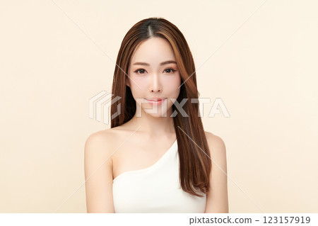 Beautiful young asian woman with clean fresh skin on beige background, Face care, Facial treatment, Cosmetology, beauty and spa, Asian women portrait. 123157919