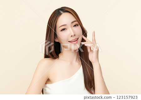 Beautiful young asian woman with clean fresh skin on beige background, Face care, Facial treatment, Cosmetology, beauty and spa, Asian women portrait. 123157923