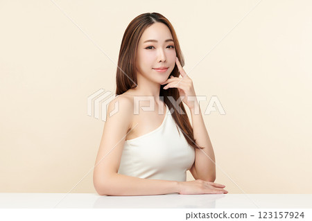 Beautiful young asian woman with clean fresh skin on beige background, Face care, Facial treatment, Cosmetology, beauty and spa, Asian women portrait. 123157924
