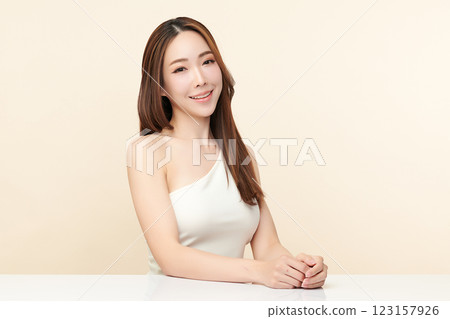 Beautiful young asian woman with clean fresh skin on beige background, Face care, Facial treatment, Cosmetology, beauty and spa, Asian women portrait. 123157926