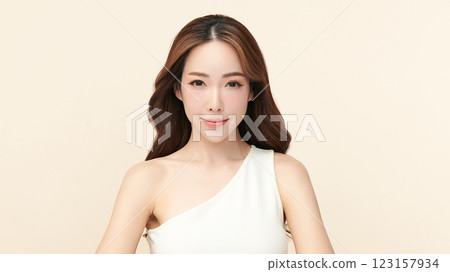 Beautiful young asian woman with clean fresh skin on beige background, Face care, Facial treatment, Cosmetology, beauty and spa, Asian women portrait. 123157934