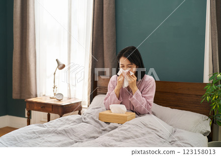 Woman blowing her nose Woman blowing her nose 123158013