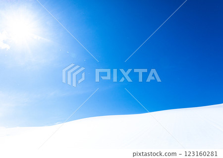 A simple landscape of blue sky, snowy fields and the sun A simple landscape of blue sky, snowy fields and the sun 123160281