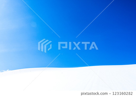 A simple landscape of blue sky and snowy fields A simple landscape of blue sky and snowy fields 123160282