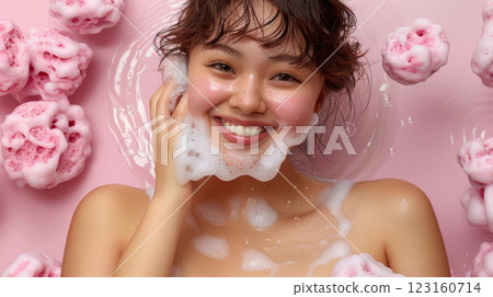 Woman relaxing with pink foam bubbles skincare 123160714