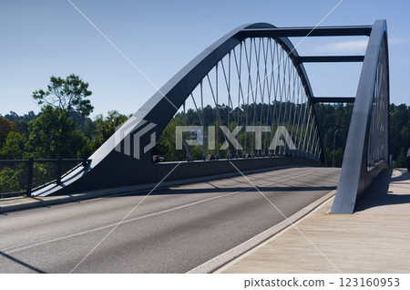 A road bridge over a valley in which a river flows and a railway line runs. A transport structure that allows you to overcome obstacles. 123160953