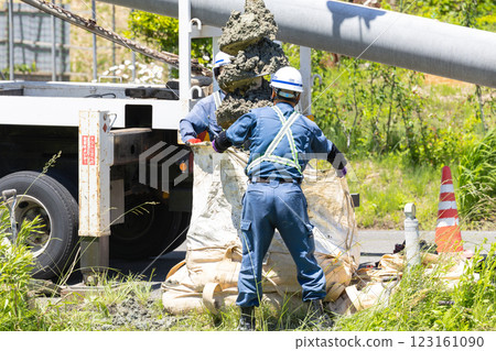 Excavation work for electric pole replacement using a pole digger vehicle Excavation work for electric pole replacement using a pole digger vehicle 123161090
